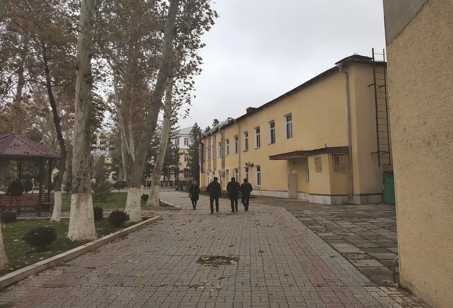 IIHM Samarkand campus walkway with students, representing a globally connected hotel management institute in Central Asia.